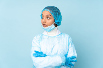 Young surgeon Indian woman in blue uniform portrait