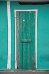 Winter sea mood in the Riviera Romagnola region of Italy. Closed beach cabins painted with bright colors waiting for the summer season to start.