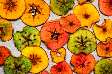 Colored dried apple chips snacks flat lay