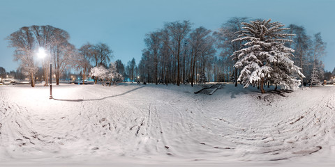 Image with 3D spherical panorama with 360 degree viewing angle. Snowy winter in park with trees at...
