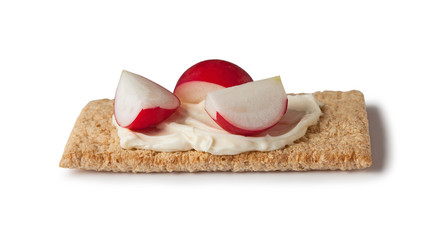 crispbread with cream cheese and radish, isolated on white background