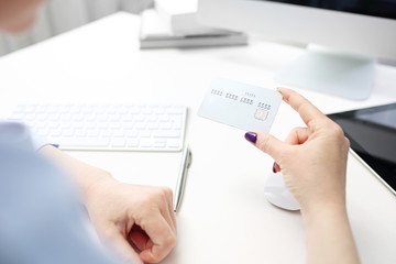Card payment for online purchases. A woman buys in an online store.