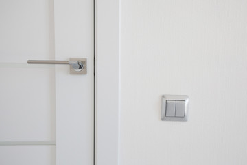 stylish doorknob and door in a design apartment - obrazy, fototapety, plakaty