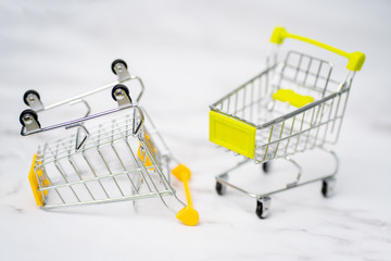 Shopping trolleys on light background
