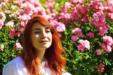 Naklejka premium Portrait of a beautiful red haired girl.