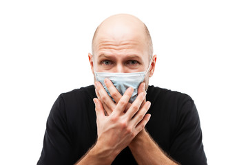 Young adult bald head man wearing respiratory protective medical mask