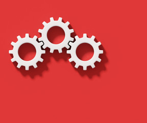 Three white connecting gear cogs isolated on red background; flat lay, close up, top view 3d rendering, 3d illustration