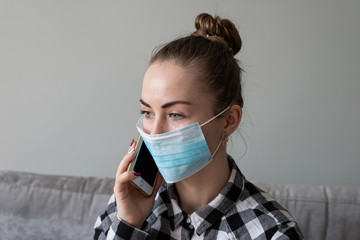 Girl with medical mask to protect her from virus. Coronavirus pandemic. Woman with mask standing ....