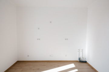 socket on a light wall in a stylish apartment