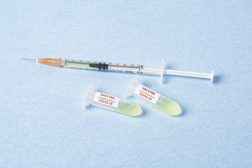 Test tube with blood sample Covid-19 (coronavirus). Laboratory testing blood. Vaccine and syringe injection It use for prevention, immunization and treatment from COVID