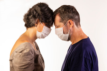 man and woman wearing protective masks on white background