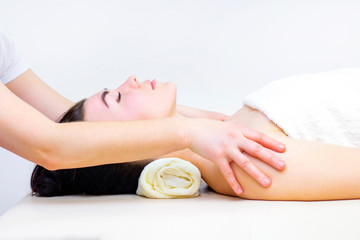 Obraz na płótnie Canvas massage in a spa salon for a girl. Wellness massage concept. light background
