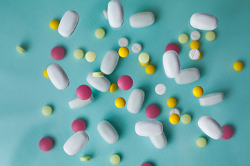 Pills for levitation. Pills on a blue background that fall down. Tablets. Medicine and health....