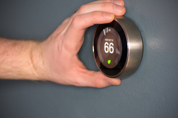 Fototapeta premium Green tech- Electric thermostat to save money and energy