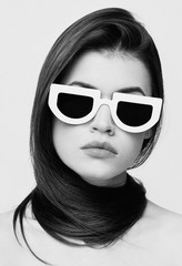 black and white portrait of an elegant girl in stylish glasses, cover studio session