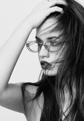 black and white portrait of an elegant girl in stylish glasses, cover studio session