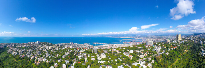 Fototapeta na wymiar Aerial panoramic view of Haifa, Israel skyline, showing houses on central Carmel area and full view of the. city bay.
