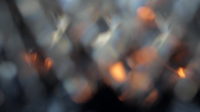 Colored bokeh in pastel colors on a dark background. Moving abstract background.