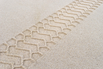 Wheel tracks of a  Dump truck on the sandy beach