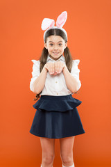 spring family holiday. little cute bunny. portrait of a playing child. having fun. funny kid wear bunny ears. girl in Easter bunny ears during egg hunt. holiday and child concept