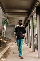 asian boy wearing a black face mask