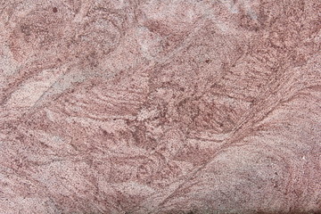 Natural texture of pink granite stone. Background for text and design