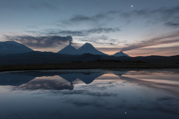 Tolbachik volcano reflection in the quiet mountain lake, Kamchatka