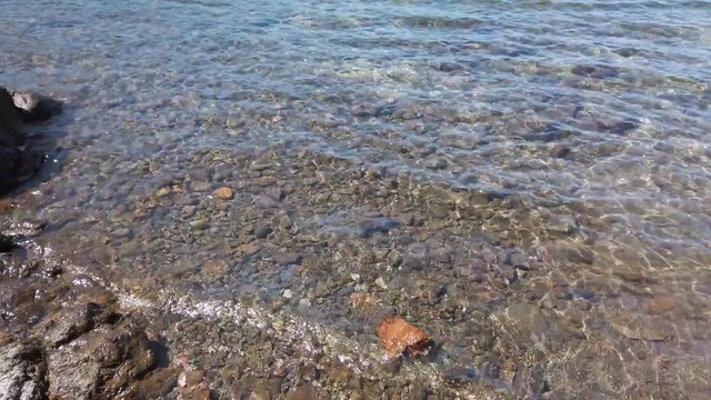 Crystal clear waters of a lake on stony shore in Patagonia Argentina