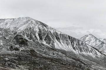 winter landscape of snow mountain with grassland 