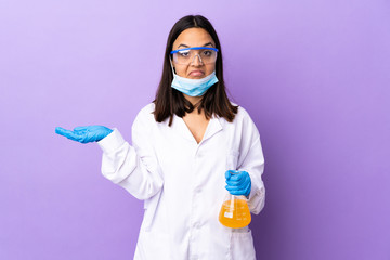 Scientist woman investigating a vaccine to cure coronavirus disease having doubts while raising...