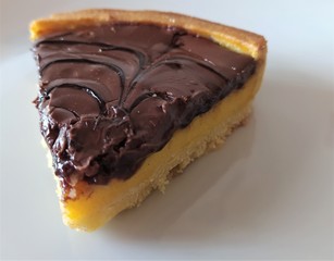 Semolina cake (torta di semolino) with chocolate. Italian cuisine. Slice of chocolate cake, close up.