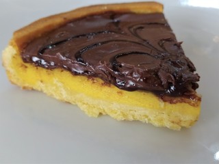  Semolina cake (torta di semolino) with chocolate. Italian cuisine. Slice of chocolate cake, close up.