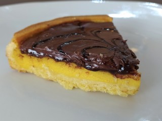 Semolina cake (torta di semolino) with chocolate. Italian cuisine. Slice of chocolate cake, close up.