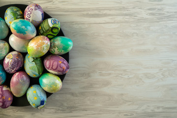 Colorful eggs for Easter decorated with euro .