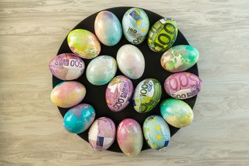 Colorful eggs for Easter decorated with euro .