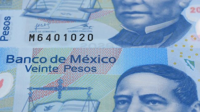Mexico peso notes slow tracking. Mexican currency. Slider shot. Low angle, 4K