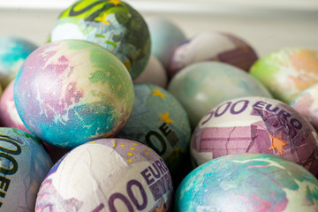Colorful eggs for Easter decorated with euro .
