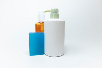 Shampoo bottles close-up. White background. A photo was taken in the studio.