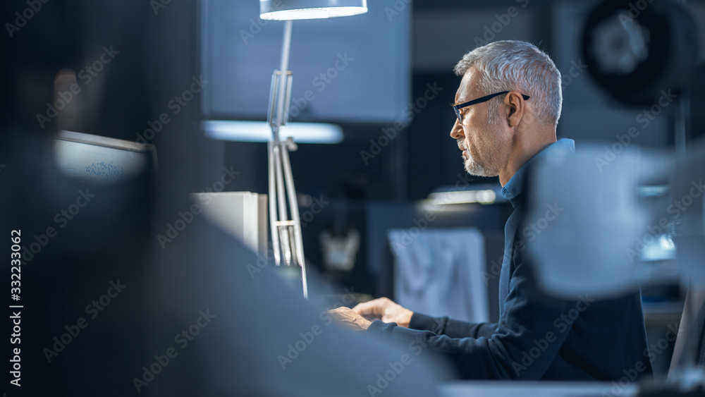 Aufkleber Shot of Industrial Engineer Working in Research Laboratory / Development Center, Using Computer. He is Working on New Efficient Engine Concept Design.