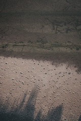 Drone view of a lake with shadow and special patterns.