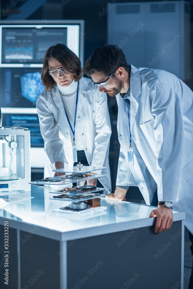 Poster Diverse International Team of Industrial Scientists and Engineers Wearing White Coats Working on Heavy Machinery Design in Research Laboratory. Professionals Using 3D Printer, Computers and Microscope
