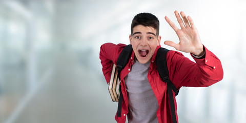 Naklejka premium teenage student in a hurry or running in college