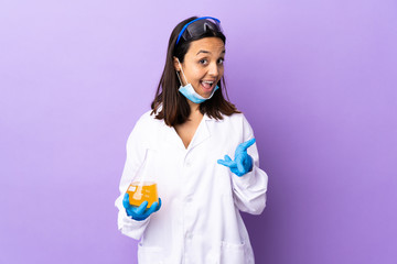 Scientist woman investigating a vaccine to cure coronavirus disease pointing to the front and...