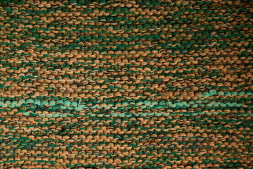 Knitted texture green color macro technique shawl.