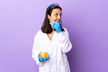 Scientist woman investigating a vaccine to cure coronavirus disease having doubts and with confuse...