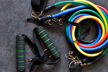 Sports accessory - expander with a carbine on a dark background.