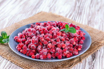 Frozen red wild strawberries