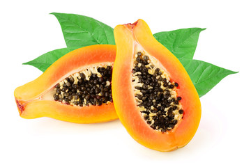 half of ripe papaya with leaves isolated on a white background