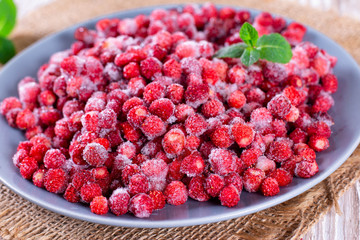 Frozen red wild strawberries