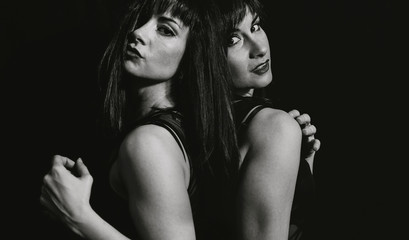 Naklejka premium women posing on black background